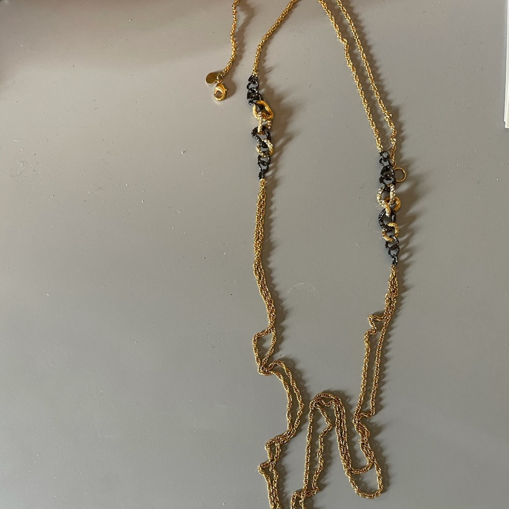 Gold long necklace with black and silver detail